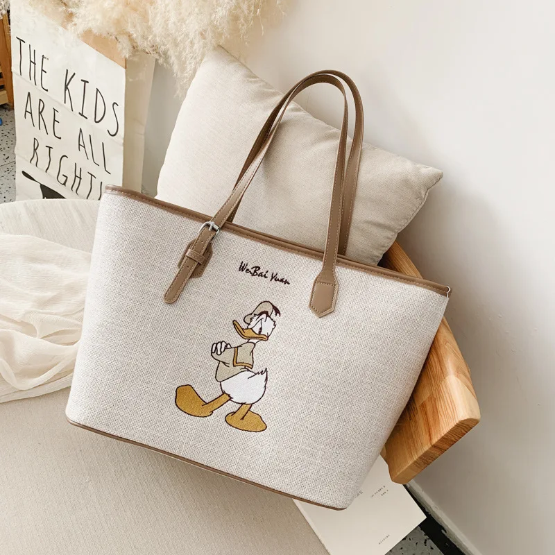Disney Minnie Vysokou kapacitou kabelky ženy Plátno taška ženy 2021 Tote bag cartoon taška Mickey ramenný prenosné nákupní taška